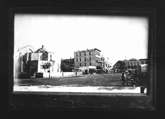 A black and white photo of a city

Description automatically generated